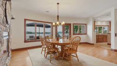Dining area right off the kitchen with access to large deck overlooking the lake