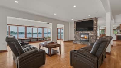 Large open family gathering space with pass-through fireplace