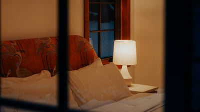 Cozy bedroom featuring inviting lighting and a warm ambiance, perfect for relaxation and restful nights.