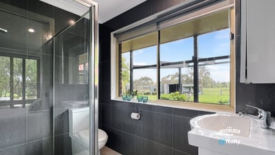 Bright bathroom featuring modern fixtures and scenic views, perfect for relaxation and comfort.