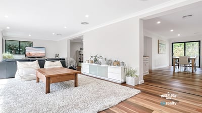 Bright and airy living space with natural light, featuring hardwood floors and an inviting, open layout.