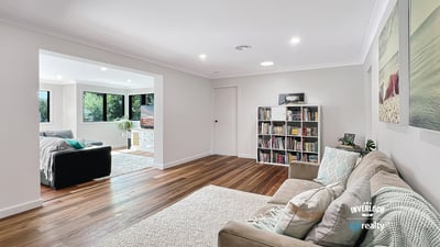 Spacious living area with modern finishes, large windows, and an inviting atmosphere perfect for relaxation.