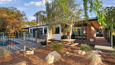 Discover this modern home featuring an inviting outdoor space, pool, and beautiful landscaping for relaxed living.
