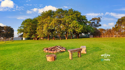 Expansive outdoor space featuring a cozy fire pit area, perfect for gatherings and relaxation.