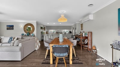 Spacious open-plan living and dining area, seamlessly connecting to a modern kitchen for effortless entertaining.