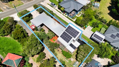 Spacious property with a solar-equipped home and ample outdoor space, conveniently located near local amenities.