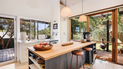 Bright and spacious kitchen featuring modern appliances and seamless indoor-outdoor flow, ideal for entertaining.