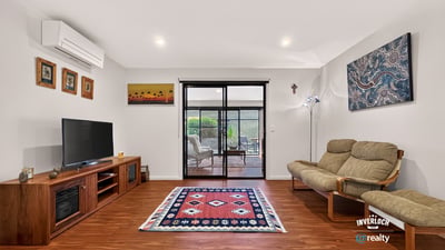 Bright living area with modern amenities, featuring large windows that invite natural light and outdoor views.