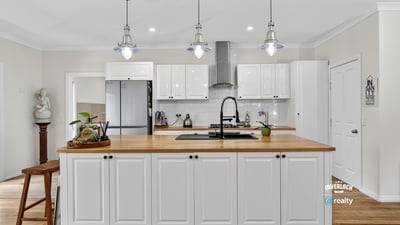 Bright and modern kitchen featuring ample cabinetry, a spacious island, and updated appliances for convenience.