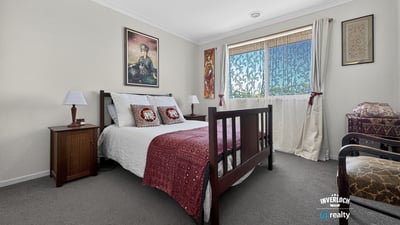Bright bedroom featuring comfortable furnishings and ample natural light, ideal for relaxation and rest.