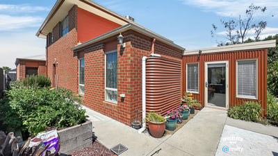 This distinctive home features a unique design, spacious garden, and ample natural light throughout.