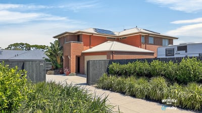This spacious two-story home features modern amenities, ample parking, and well-maintained landscaping in a prime location.