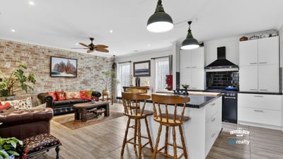 Bright and inviting open-concept living space featuring modern amenities and a cozy atmosphere.