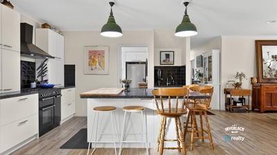 Modern kitchen with a spacious island, perfect for entertaining and everyday functionality, awaits your culinary creativity.