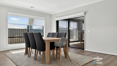 Spacious dining area with natural light, perfect for gatherings and enjoying views of the outdoor space.