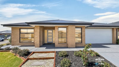 Spacious single-level home featuring modern architecture and easy-maintenance landscaping, set in a desirable neighborhood.