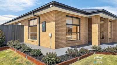Modern brick home featuring clean lines and ample outdoor space for family gatherings and activities.