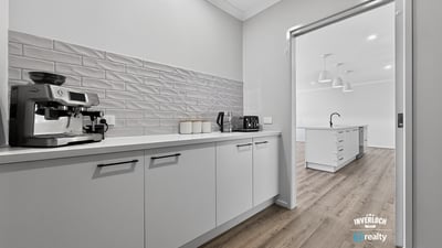 Modern kitchen featuring sleek cabinetry and ample space, perfect for culinary enthusiasts and entertaining guests.