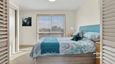 Bright and inviting bedroom featuring natural light, comfortable furnishings, and a peaceful atmosphere.