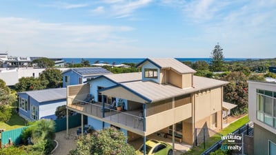 Experience coastal living in this spacious home with stunning ocean views and ample outdoor space.