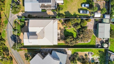 Spacious property featuring a sprawling yard, ideal for outdoor activities and potential landscaping projects.