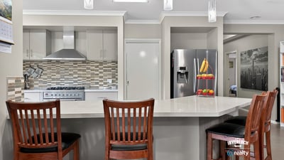 Modern kitchen featuring sleek appliances, a spacious island, and ample natural light for cooking and entertaining.