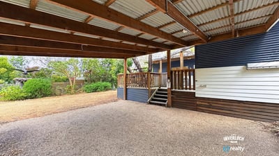 Spacious covered outdoor area perfect for gatherings and enjoying the surrounding natural landscape.