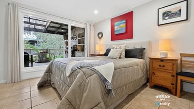 Bright and inviting bedroom featuring direct access to a private outdoor terrace for relaxed living.