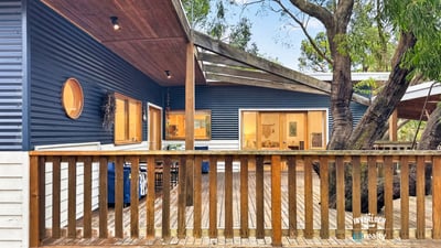 Discover this unique home featuring an open deck, contemporary design, and natural surroundings for optimal outdoor living.