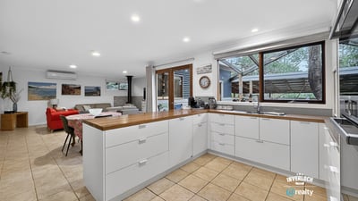 Bright and functional kitchen featuring ample counter space, modern appliances, and open access to the living area.