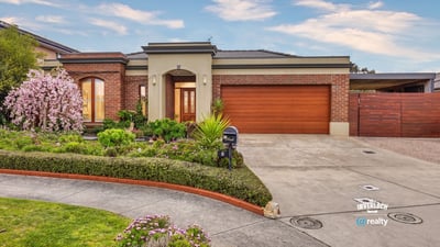 Discover this inviting home featuring lush landscaping, a spacious driveway, and ample natural light throughout.