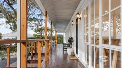 Discover this inviting porch offering a perfect blend of outdoor relaxation and easy access to the home.