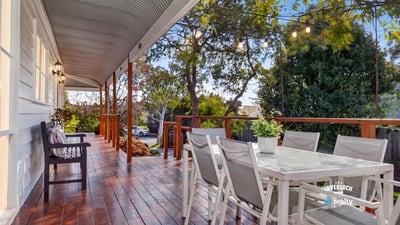 Relax on this expansive deck with captivating views and ample space for entertaining family and friends.