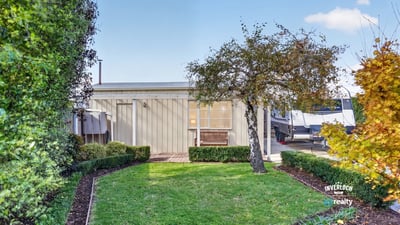 This modern property features a landscaped garden and inviting outdoor space perfect for relaxation and entertainment.