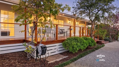 Discover this inviting home featuring a spacious deck, landscaped gardens, and modern amenities throughout.