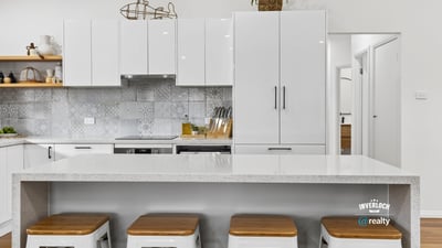 Modern kitchen featuring sleek cabinetry, a spacious island, and contemporary finishes perfect for entertaining.