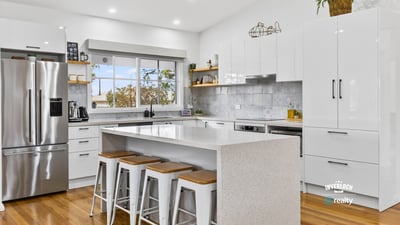 Bright, modern kitchen featuring sleek cabinetry, stainless steel appliances, and a spacious island for entertaining.