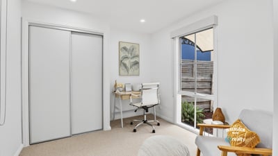 Bright and functional office space featuring natural light, modern furnishings, and streamlined storage solutions for productivity.