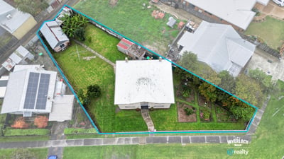 Spacious property featuring a large yard, multiple outbuildings, and convenient access to local amenities.