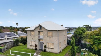 Spacious two-story home with ample outdoor space and panoramic views, perfect for family gatherings or relaxation.