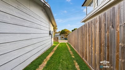 This property features a spacious side yard, perfect for outdoor activities or potential landscaping opportunities.