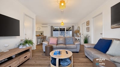 Spacious living area featuring modern amenities and abundant natural light, perfect for relaxation and entertaining.