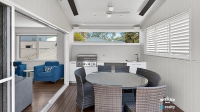 Bright and spacious outdoor entertaining area featuring modern amenities and a seamless indoor-outdoor flow.