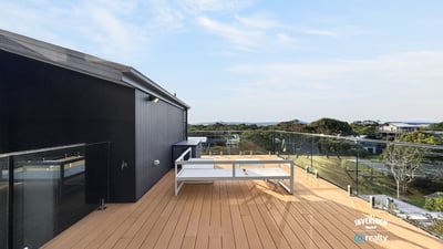 Enjoy breathtaking views from this spacious deck, perfect for outdoor gatherings and relaxation.