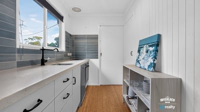 Bright kitchen featuring modern appliances and ample storage, perfect for culinary enthusiasts and everyday living.