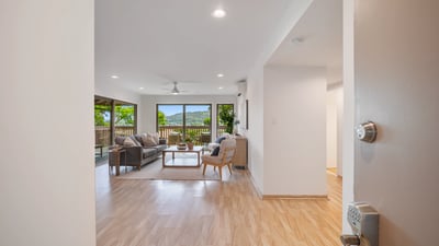 Spacious living area with natural light, seamlessly connecting to outdoor views and a relaxing atmosphere.