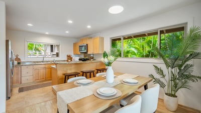 Bright and inviting kitchen features modern appliances, ample counter space, and a cozy dining area.