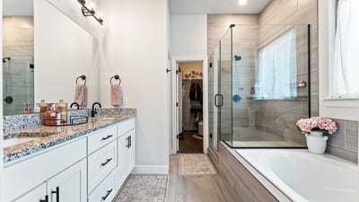 Primary bath soaking tub, walk in shower with glass surround. Dual sink vanity & walk in closet