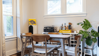 Bright dining area featuring natural light, modern furnishings, and a cozy atmosphere perfect for gatherings.