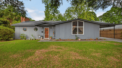 Spacious home with distinctive architecture and a landscaped yard, perfect for comfortable living and entertaining.